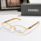 Chanel eyeglasses, gold frame with clear lenses and round-rectangular shape