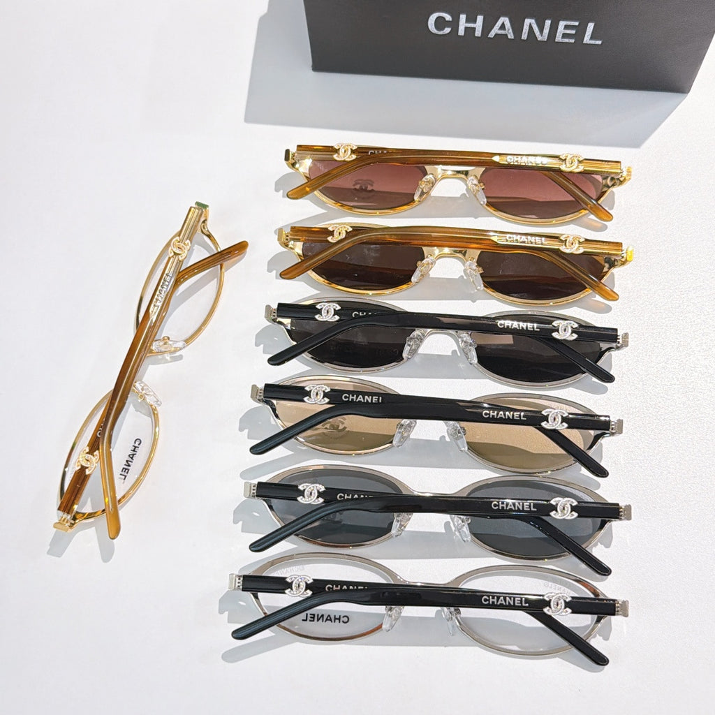 Chanel glasses assortment, multiple frames in gold, black, and tortoiseshell