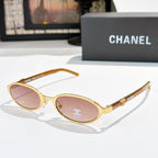 Chanel eyeglasses, gold frame with rose-tinted lenses and rounded oval shape