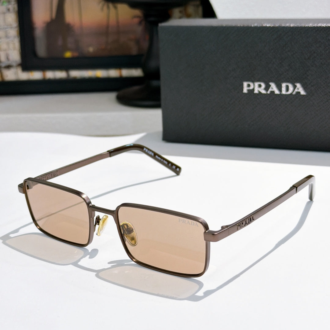 Prada sunglasses with brown tinted lenses and gold-tone rectangular frames