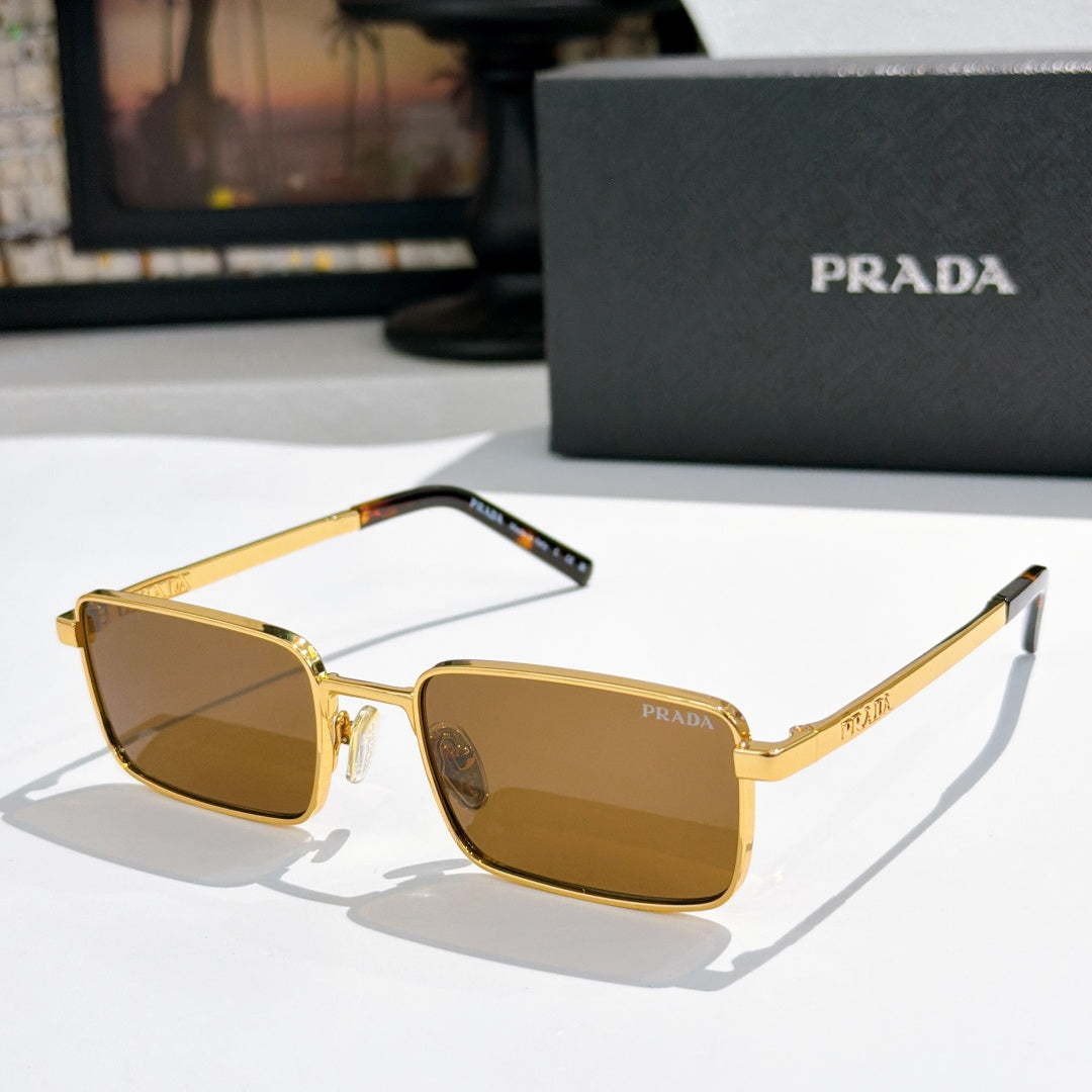 Prada sunglasses with warm amber lenses and gold-tone rectangular frames