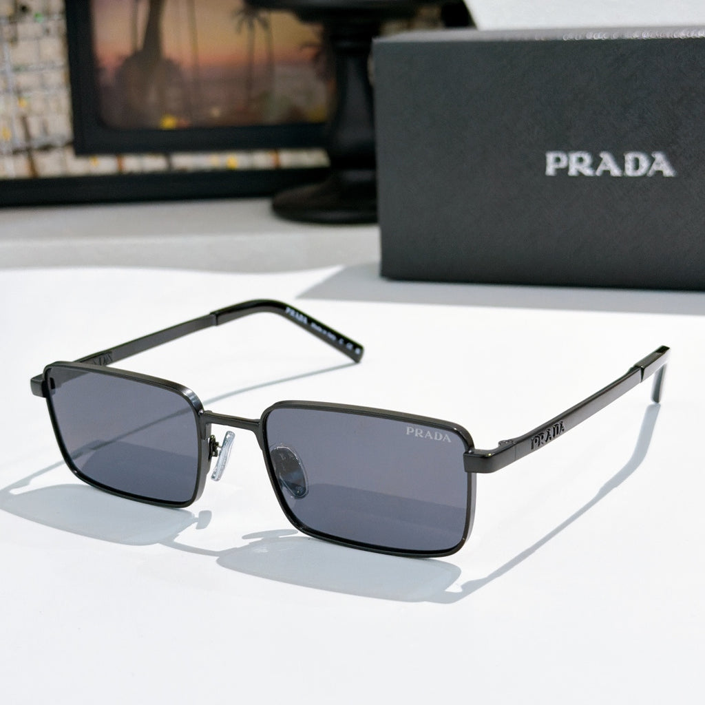 Prada sunglasses with dark blue tinted lenses and black-and-silver rectangular frames