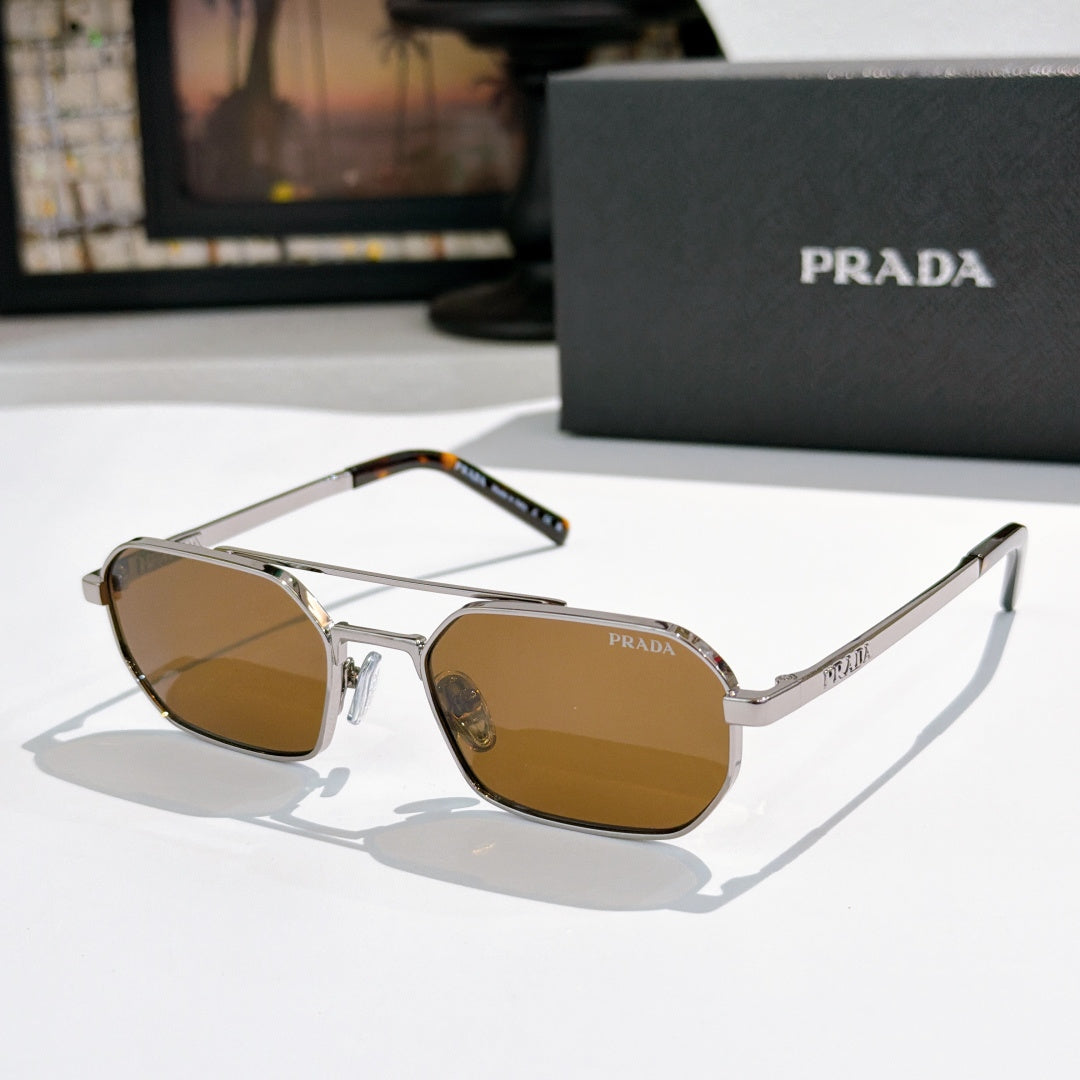 Prada sunglasses with silver frame and amber-tinted lenses