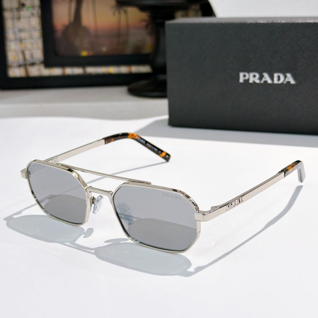 Prada sunglasses with silver frame and light blue-tinted lenses