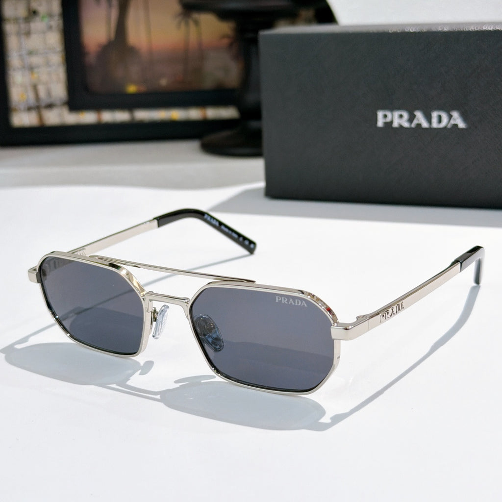 Prada sunglasses with silver frame and dark blue-tinted lenses