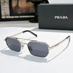 Prada sunglasses with silver frame and dark blue-tinted lenses