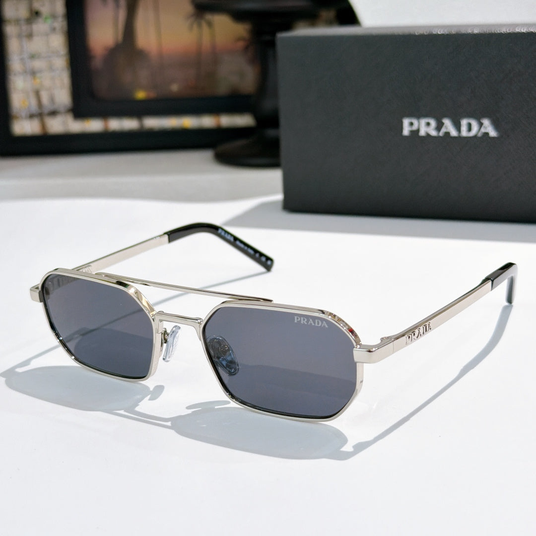 Prada sunglasses with silver frame and dark blue-tinted lenses