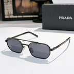 Prada sunglasses with dark frame and blue-tinted hexagonal lenses
