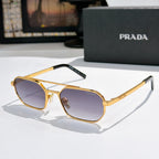 Prada sunglasses with gold frame and purple-tinted lenses