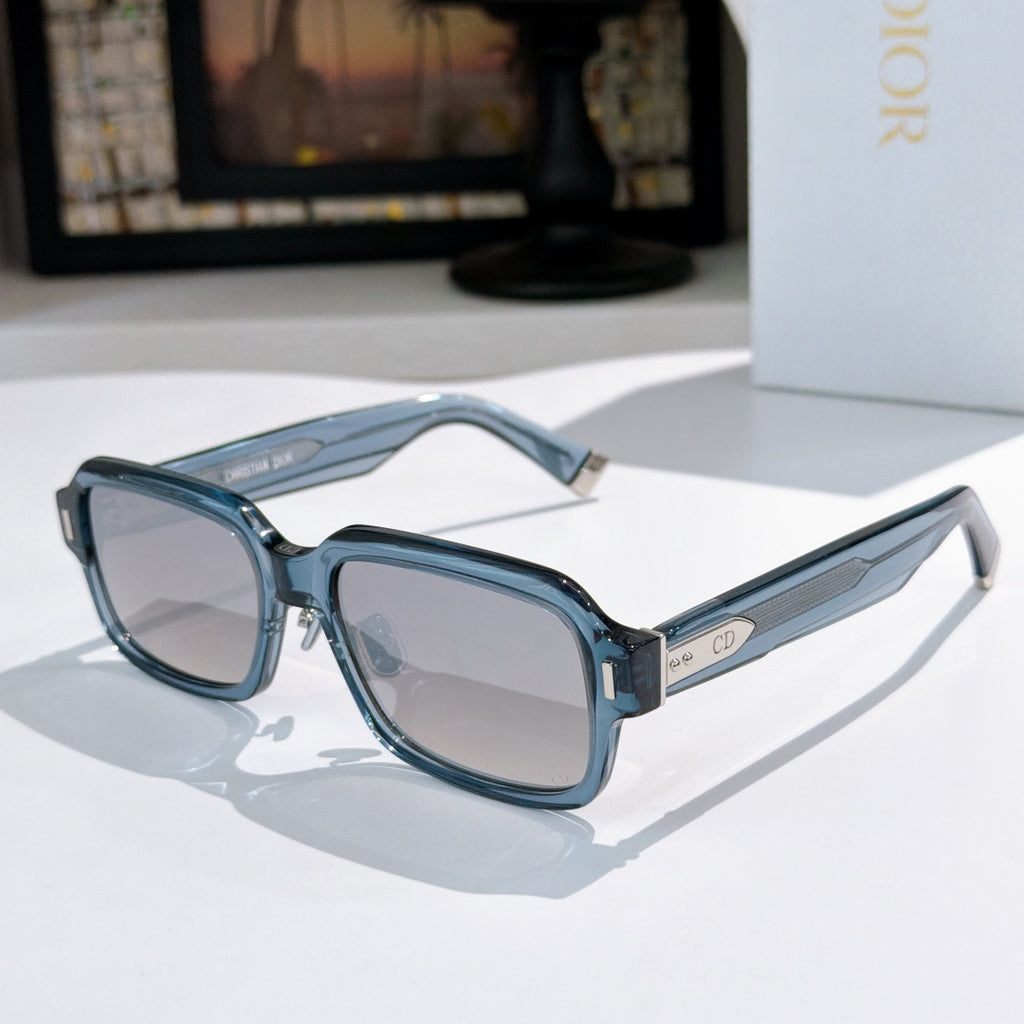 Dior sunglasses with teal-blue frames and gray tinted lenses