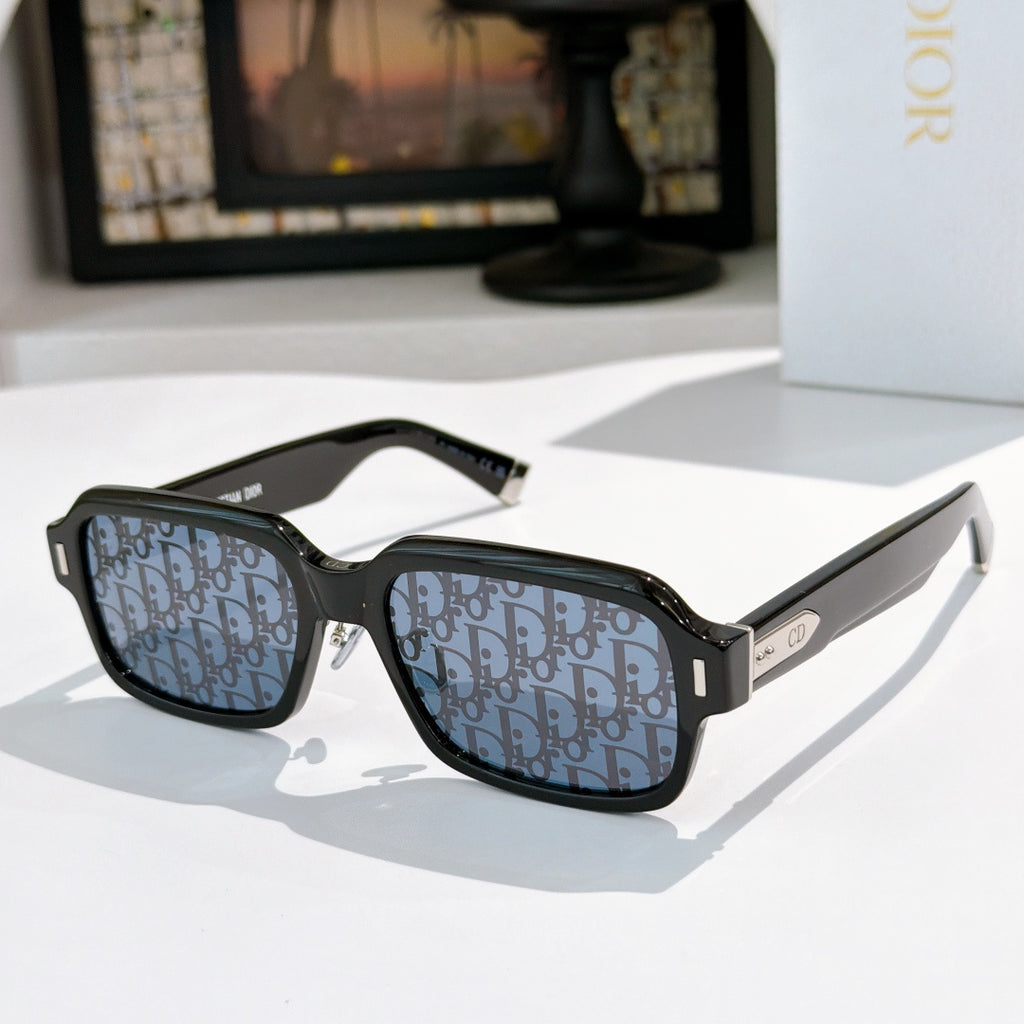 Dior sunglasses with black frames and blue patterned lenses