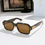 Dior sunglasses with tortoiseshell frames and amber tinted lenses