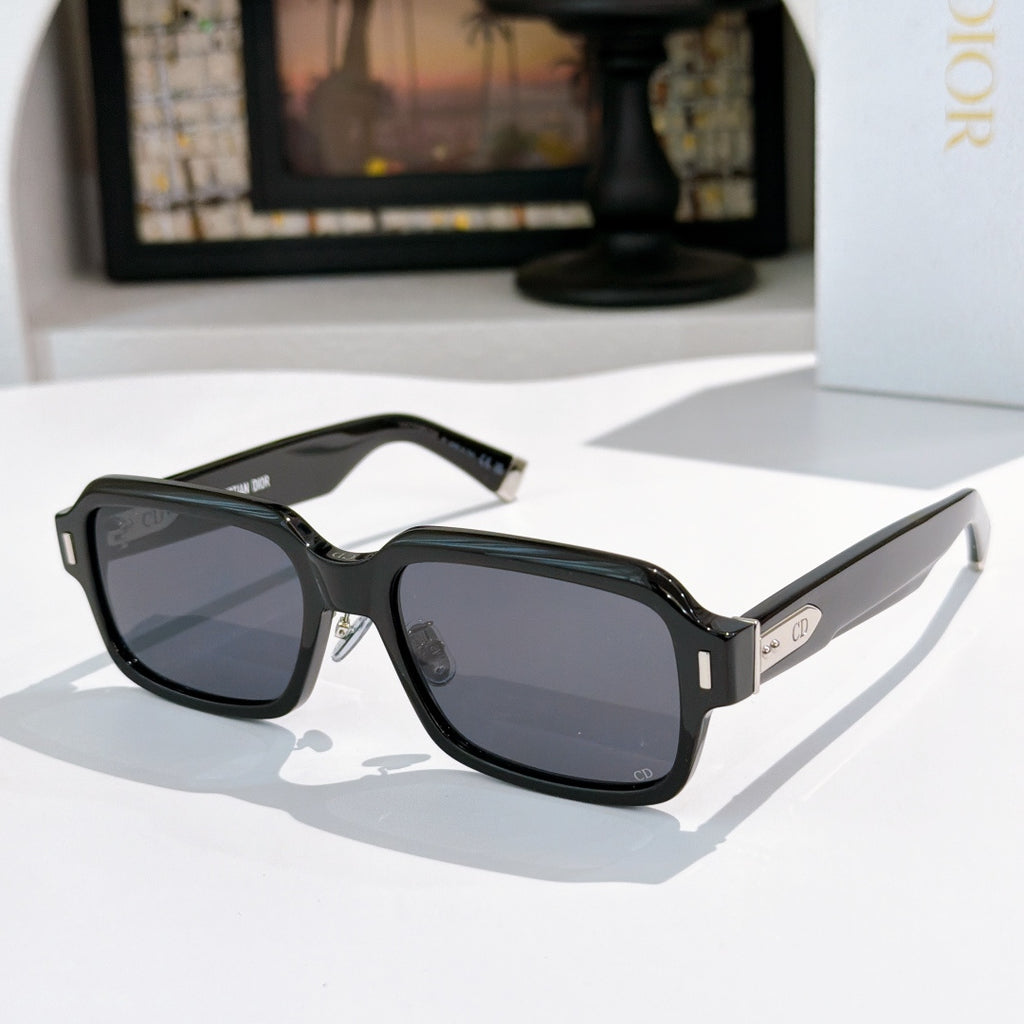 Dior sunglasses with black frames and black tinted lenses