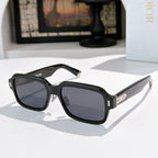 Dior sunglasses with black frames and black tinted lenses