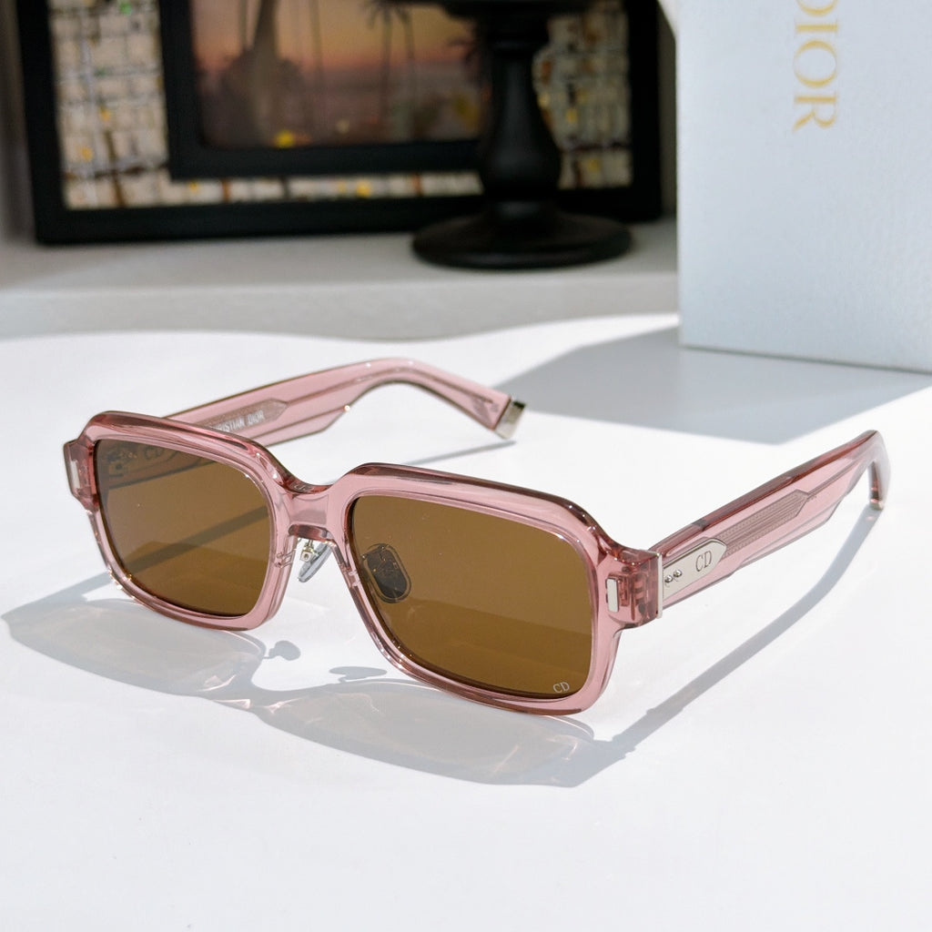 Dior sunglasses with pink frames and warm brown tinted lenses
