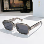 Dior sunglasses with translucent frames and dark gray tinted lenses