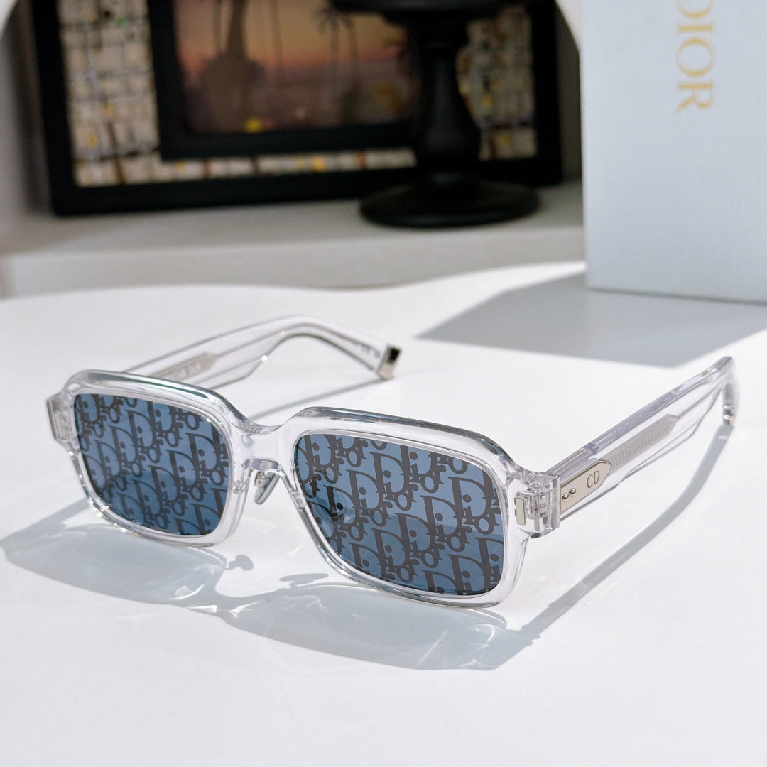 Dior sunglasses with clear frames and blue patterned lenses