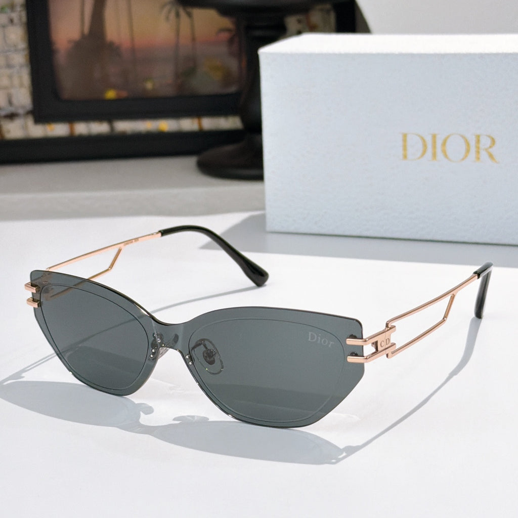 Dior cat-eye sunglasses with dark gray lenses and gold-tone frame, black arms