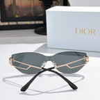 Dior cat-eye sunglasses with dark teal lenses and black frame with gold accents