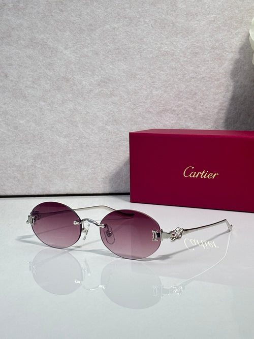 Round mauve-tinted sunglasses with gold-tone metal frames and curved top bar