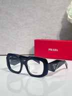 Prada eyeglasses with dark blue frames and clear lenses, front view