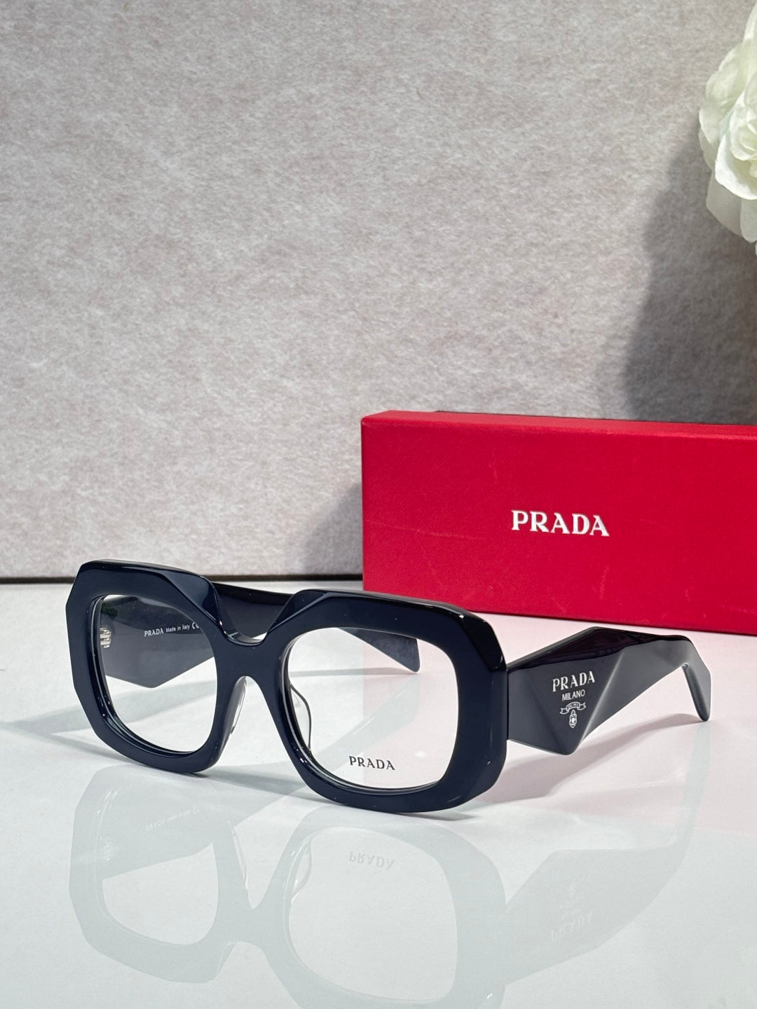 Prada eyeglasses with dark blue frames and clear lenses, front view