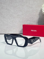 Prada dark navy rectangular eyeglasses with clear lenses and logo temples