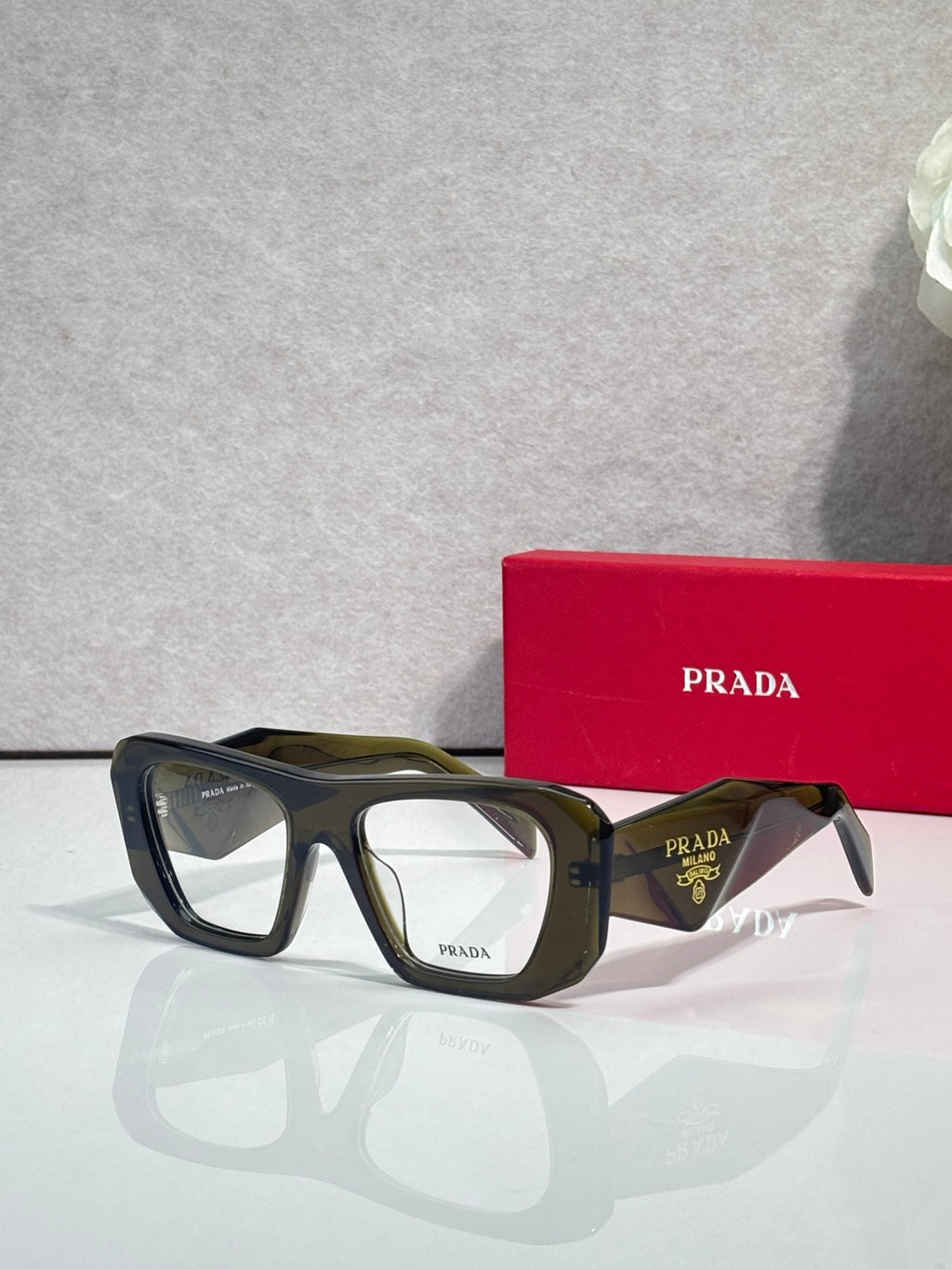 Prada olive green rectangular eyeglasses with clear lenses and dark temples