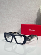 Prada black rectangular eyeglasses with clear lenses and tortoise-accent temples