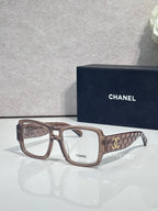 Brown rectangular eyeglasses with CHANEL logo and patterned temple arms