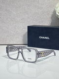 Clear rectangular eyeglasses with CHANEL logo and patterned temple arms