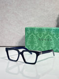 Gucci blue rectangular eyeglasses with clear lenses and gold logo detail