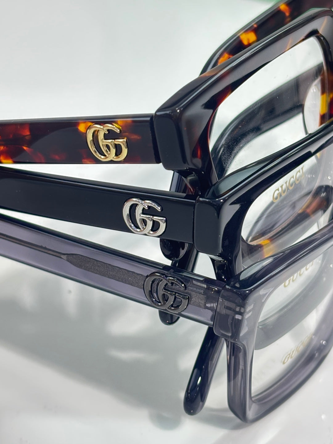 Gucci dark blue rectangular eyeglasses with GG logo on temple hardware