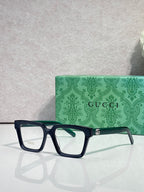 Gucci dark blue rectangular eyeglasses with clear lenses and gold logo detail