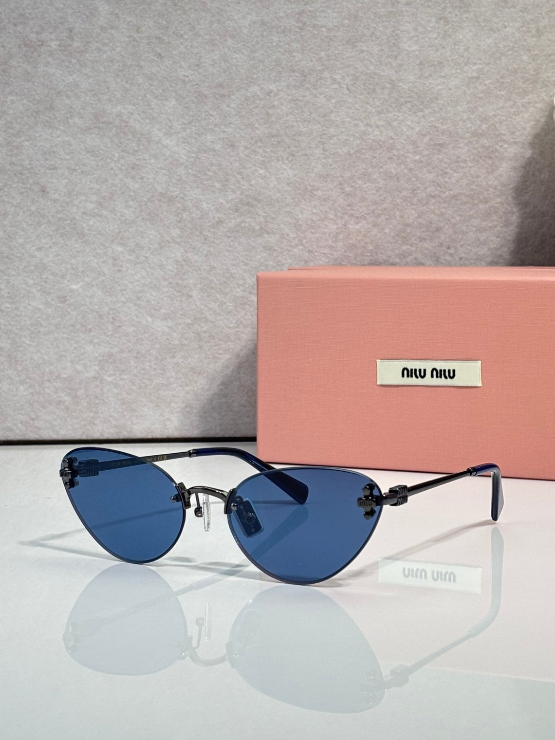 Sunglasses with blue round frames and blue tinted lenses