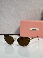 MiuMiu sunglasses with black round frames and dark brown tinted lenses