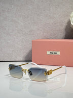 Sunglasses with light blue lenses, gold metal frame, black arms