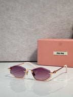 Gold-tone sunglasses with purple lenses and metal frame, rectangular cat-eye style.