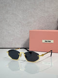 Gold-tone sunglasses with dark blue lenses and black arms, rectangular cat-eye style.