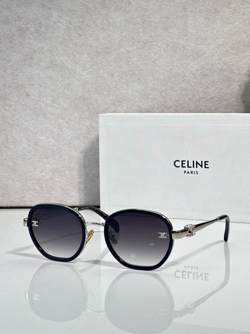 Round sunglasses with dark blue frame and dark lenses, gold-tone hinges and bridge