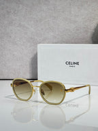 Round sunglasses with light gold frame and amber lenses, gold-tone hinges