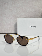Celine sunglasses with round gold frames and dark tinted lenses