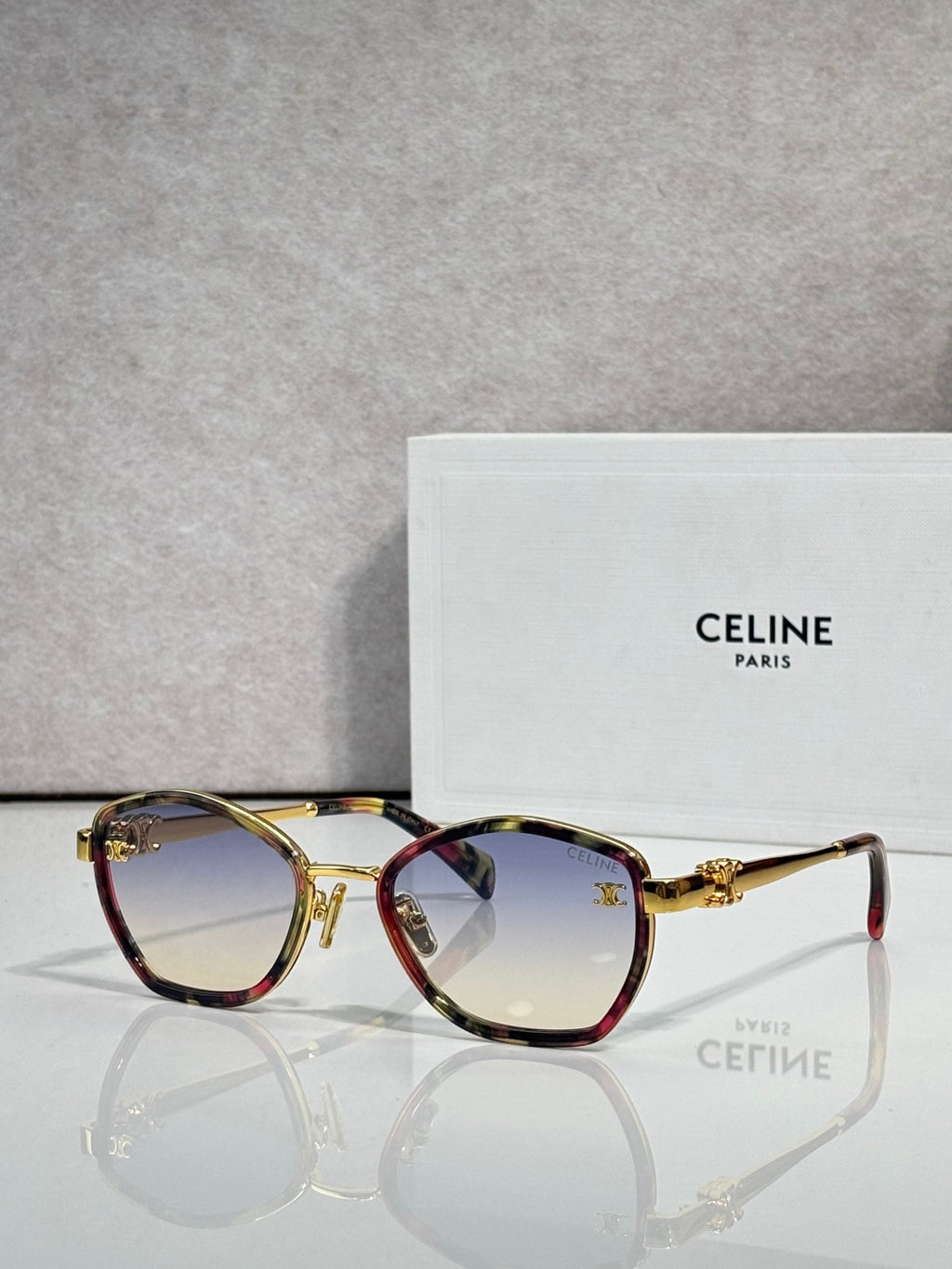Celine sunglasses with round tortoiseshell frames and tinted lenses, gold-tone hardware
