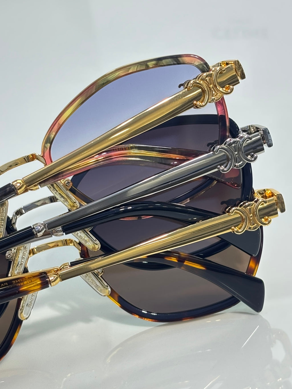 Celine sunglasses close-up with overlapping frames and gold-tone temple accents
