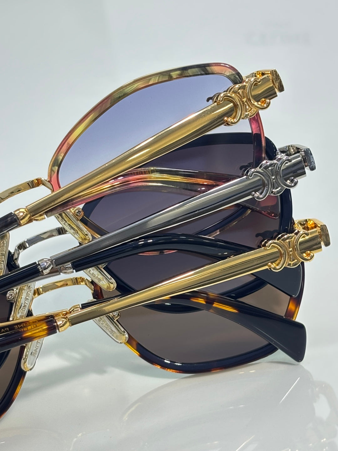 Celine sunglasses close-up with overlapping frames and gold-tone temple accents