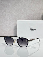 Celine sunglasses with round dark frames and tinted lenses, gold-tone details
