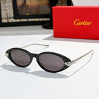 Black oval sunglasses with dark lenses and silver-tone temple bars