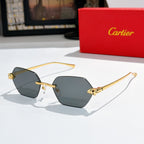 Sunglasses with charcoal gray hexagonal lenses and gold-tone metal frame