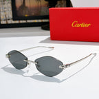 Silver-tone round sunglasses with dark lenses and patterned temple accents