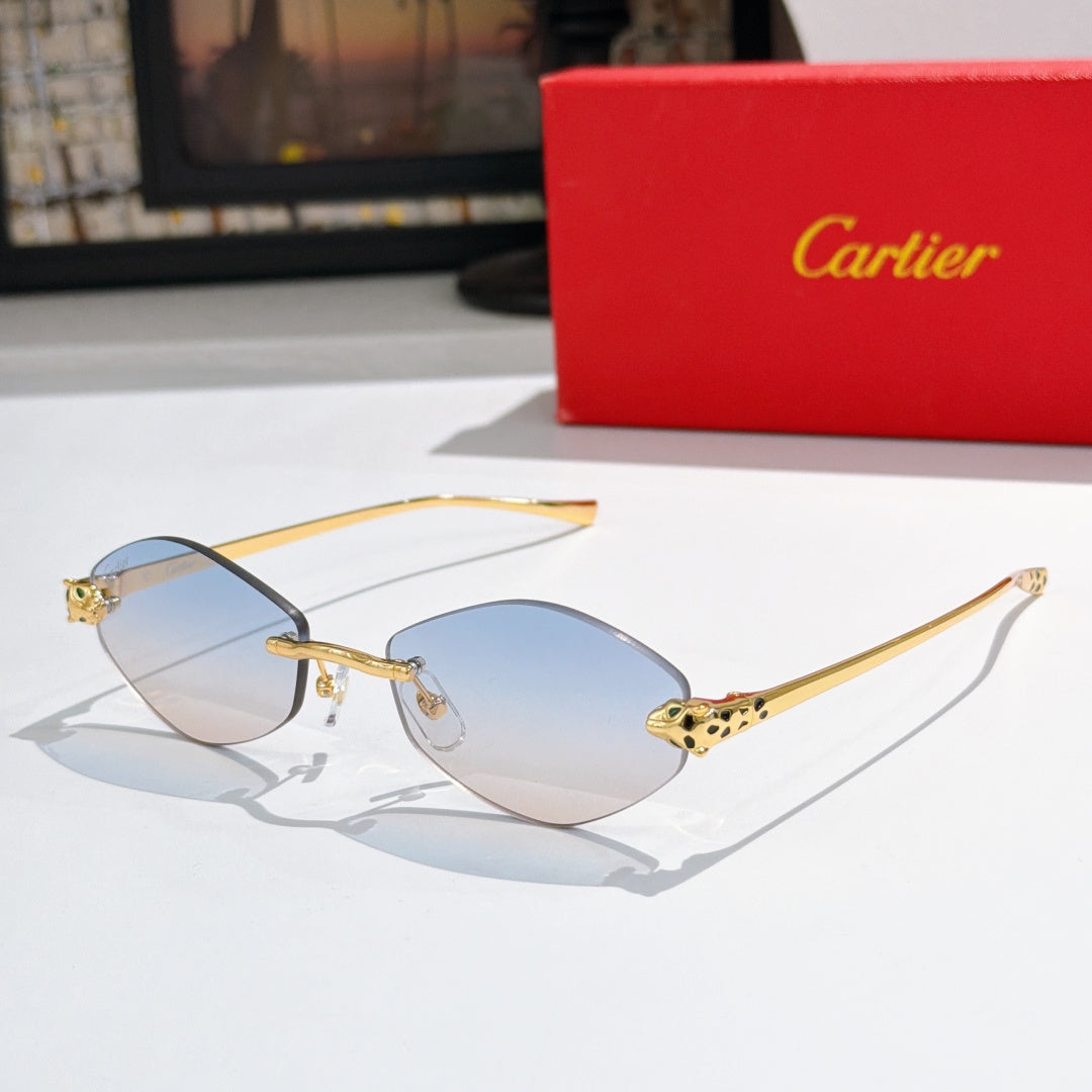 Gold-tone round sunglasses with light blue lenses and patterned temple accents
